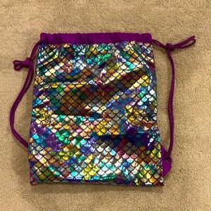 Mermaid in cinch bag.